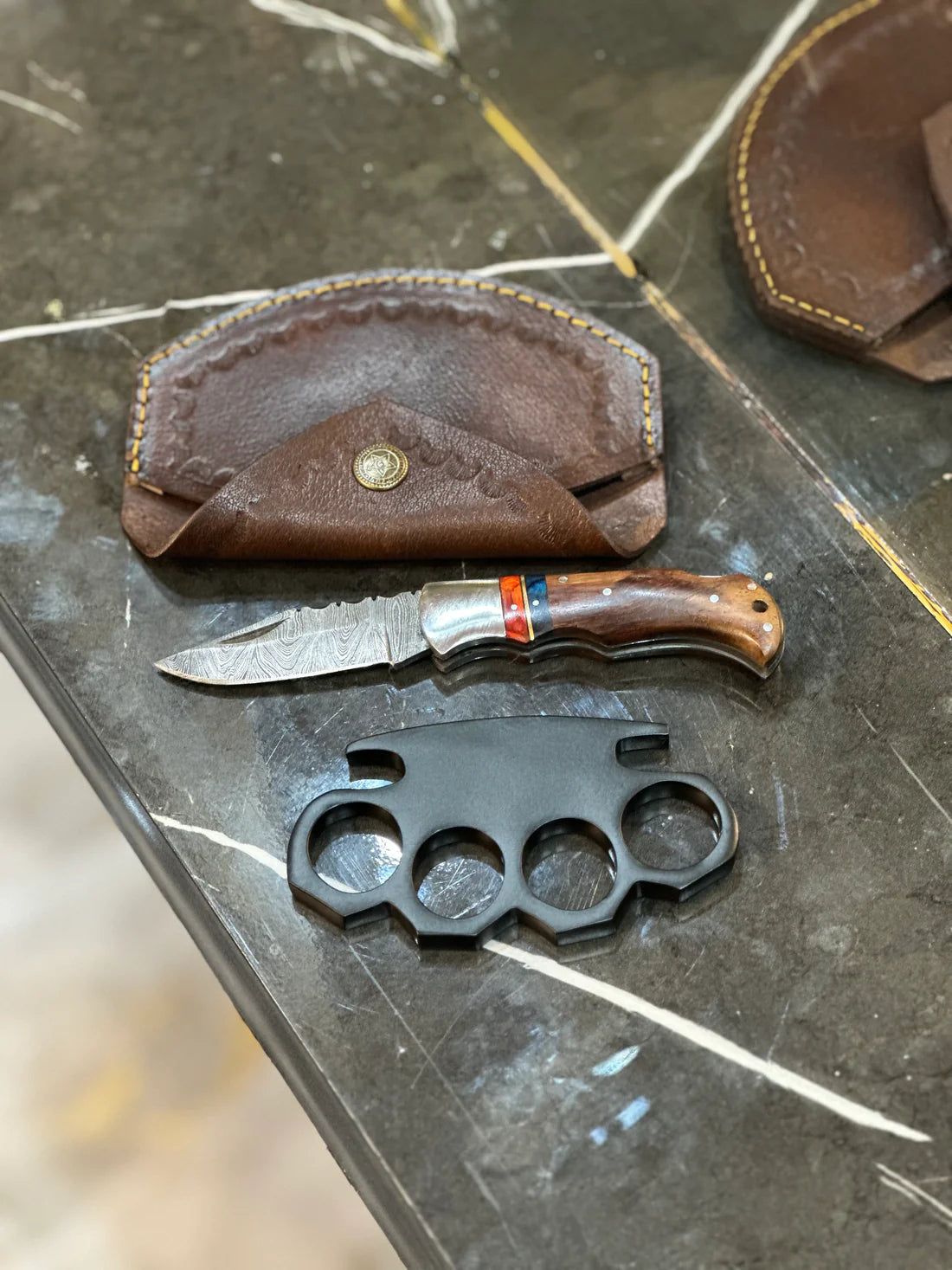 Custom handmade knuckle and folding knife